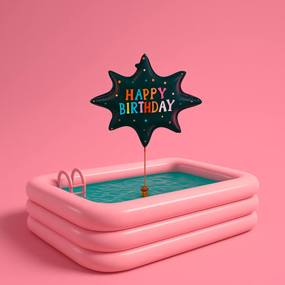 Pink inflatable pool with a 'Happy Birthday' balloon on a pink background