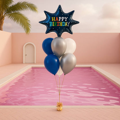 Balloon bouquet with 'Happy Birthday' star-shaped balloon over a pool and pink wall.