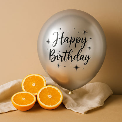 Silver balloon with 'Happy Birthday' text and sliced oranges on a beige background