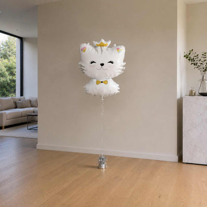 Cat-shaped balloon with a bow tie in a living room setting