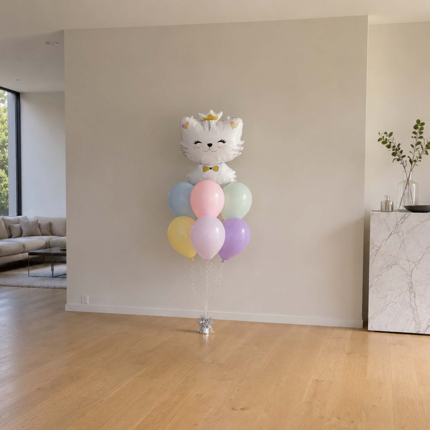 Balloon arrangement with a cat design in a living room setting
