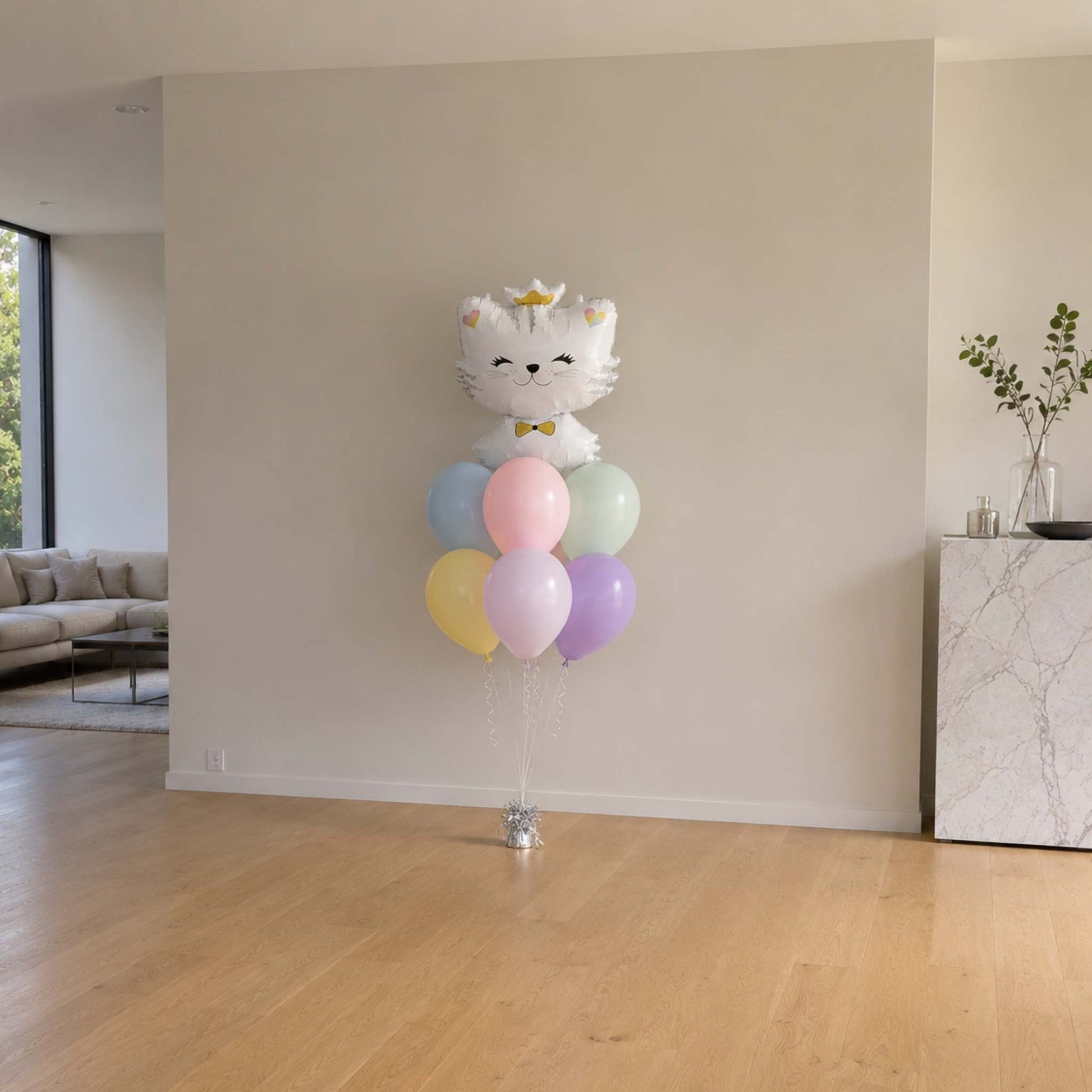 Balloon arrangement with a cat design in a living room setting