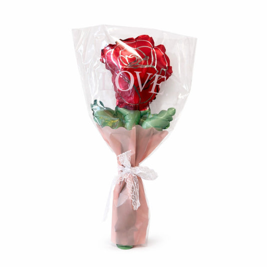 Bouquet of red roses with green leaves in clear plastic wrap on a white background