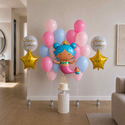 Colorful balloon arrangement with a mermaid balloon and 'Happy Birthday' balloons in a room.