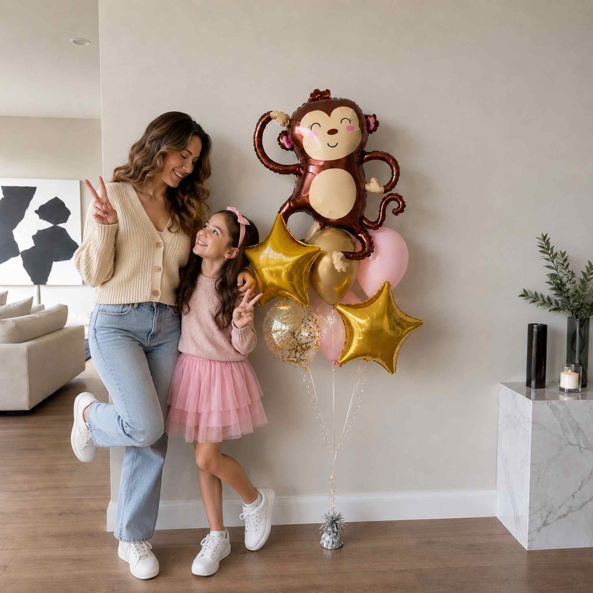 Woman and child with monkey-shaped balloon in a living room