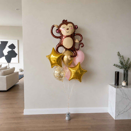 Balloon bouquet with monkey design in a living room setting
