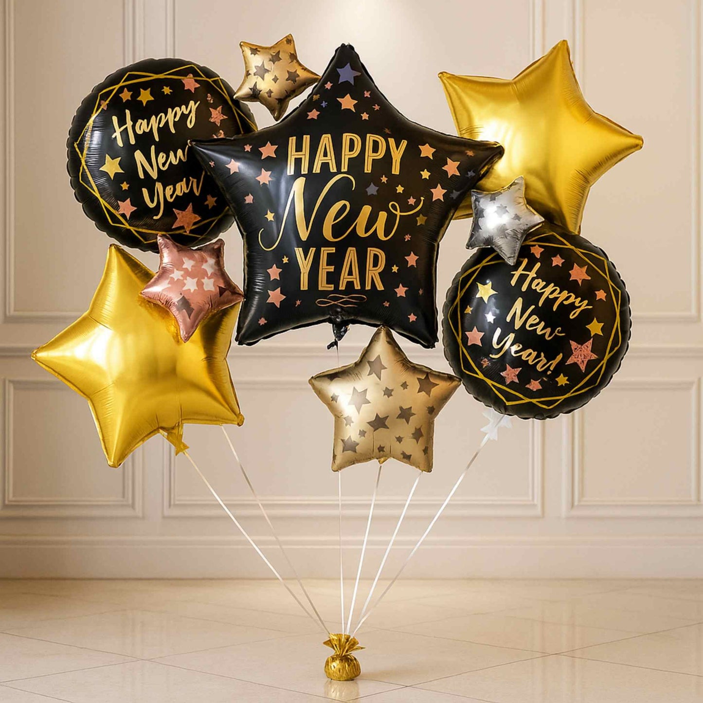 Collection of 'Happy New Year' themed balloons against a neutral wall.