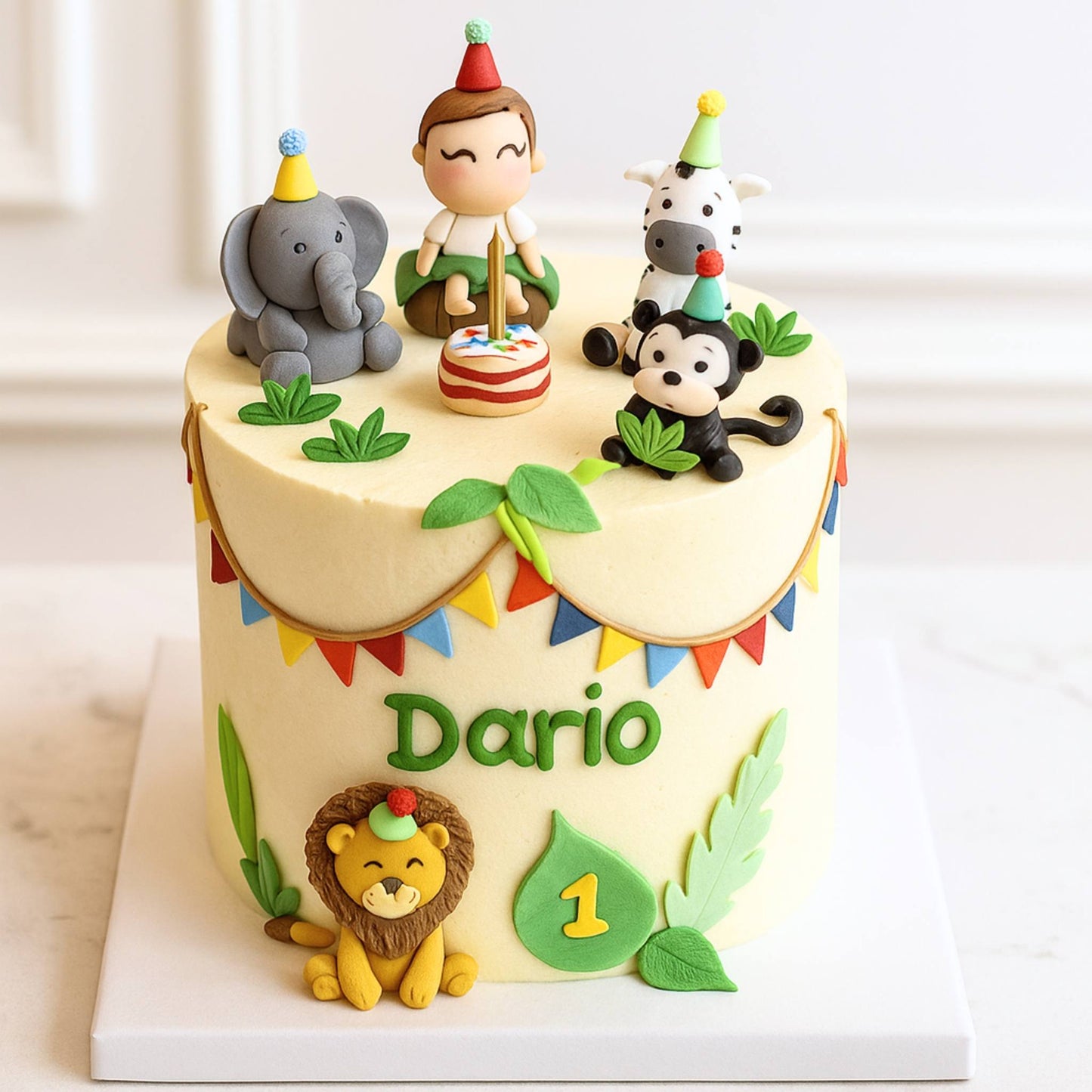 Children's birthday cake with animal figurines and 'Dario' on a white background