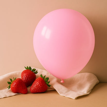 Pink balloon and strawberries on a beige background