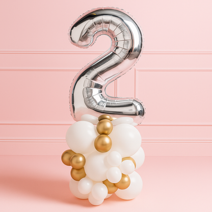 Silver number 2 balloon on a pink background