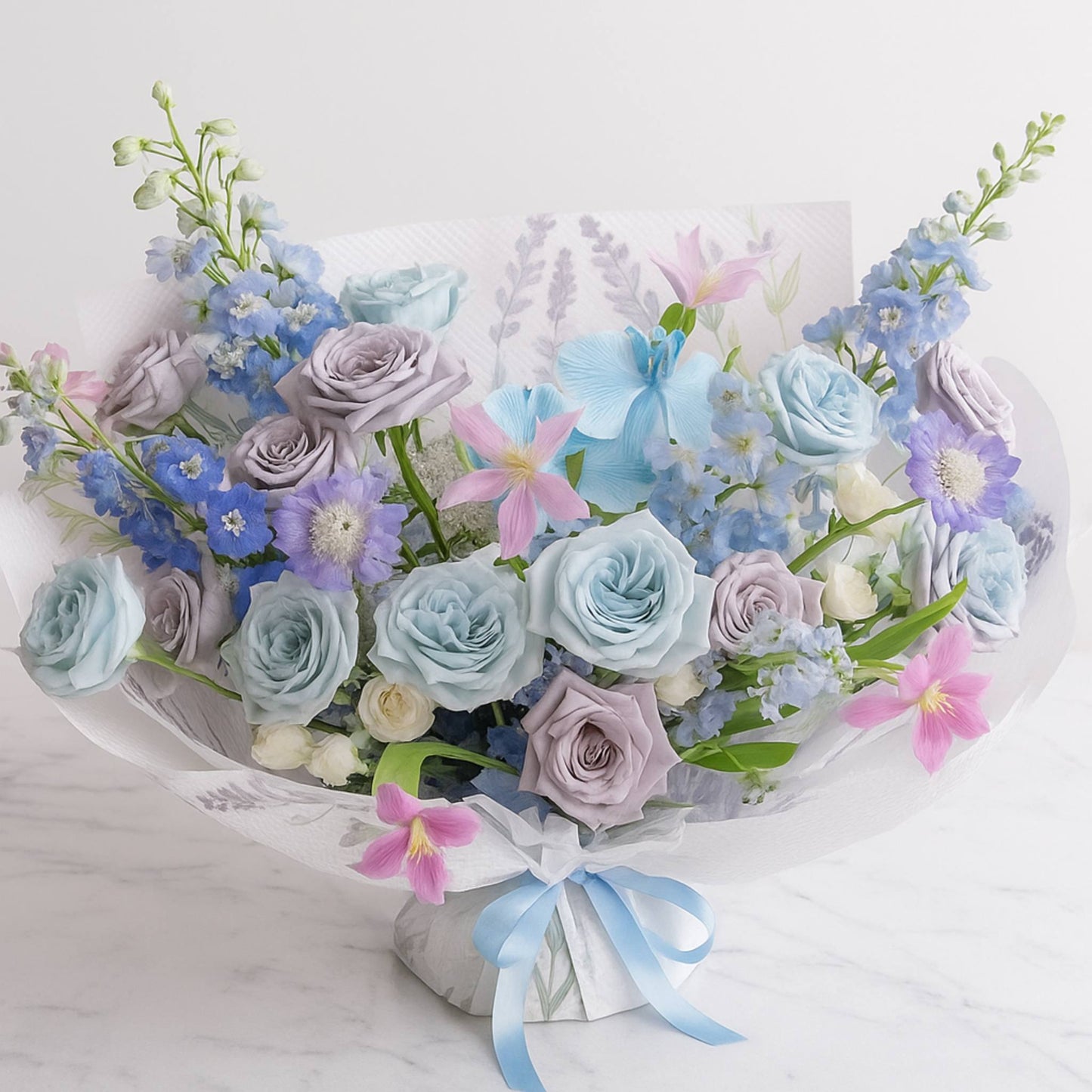 Bouquet of flowers with blue, pink, and white colors on a light background