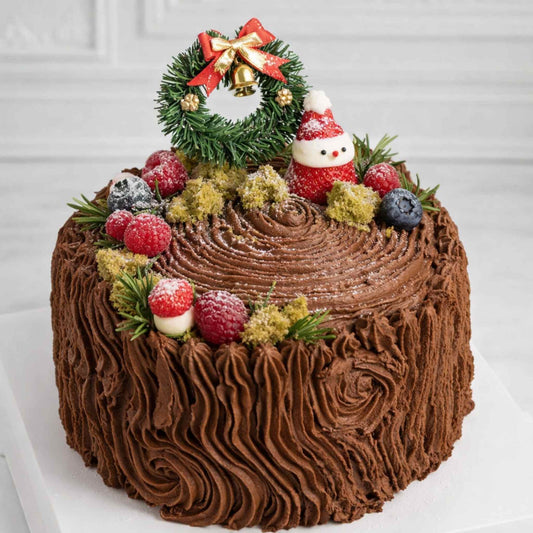 Chocolate cake with Christmas decorations on a white background