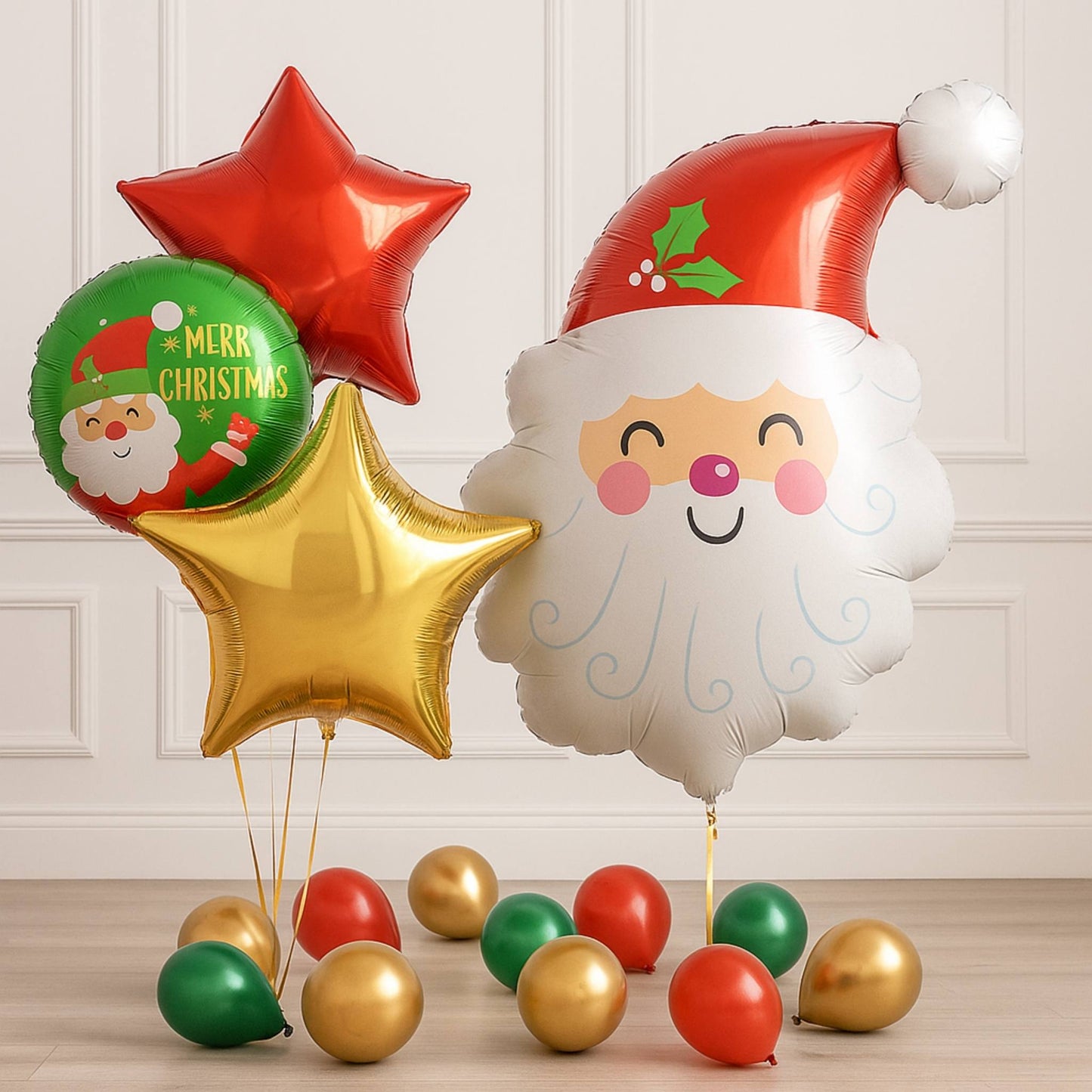 Christmas-themed balloons including a Santa face balloon, red star, and colorful round balloons on a light wooden floor.