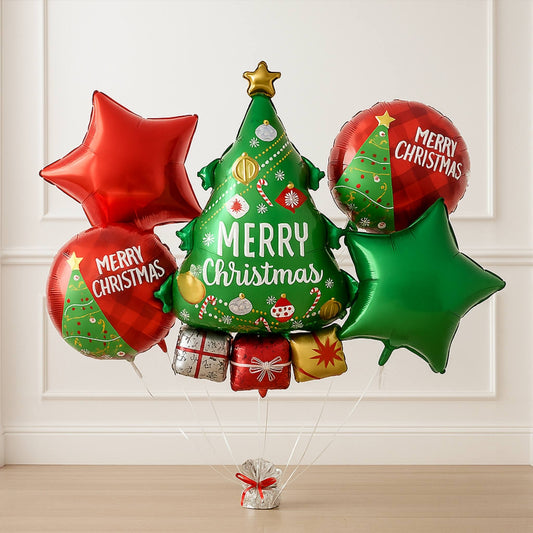Christmas-themed balloons with 'Merry Christmas' text and festive designs on a white paneled wall background.