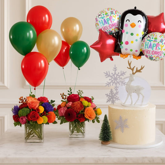 Decorative setup with balloons, flowers, and a cake on a marble surface.