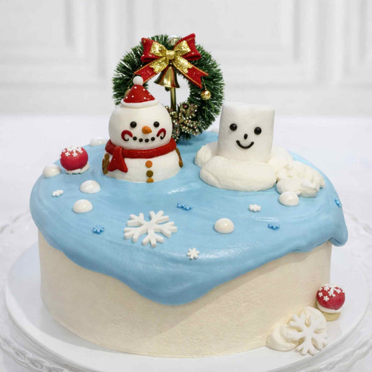 Christmas-themed cake with snowman and marshmallow design on a white background