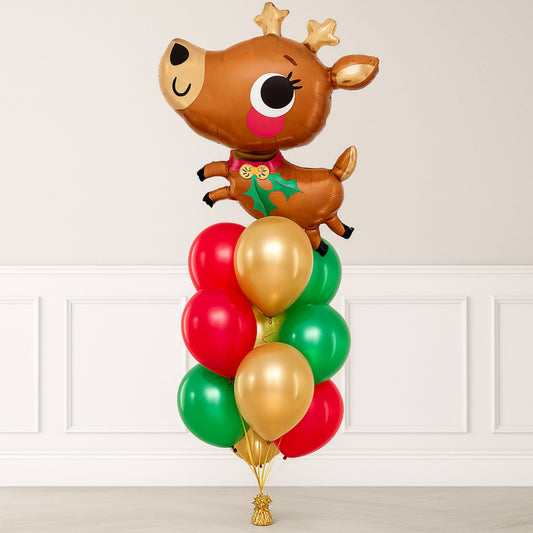 Balloon arrangement with a reindeer design on a white wall background
