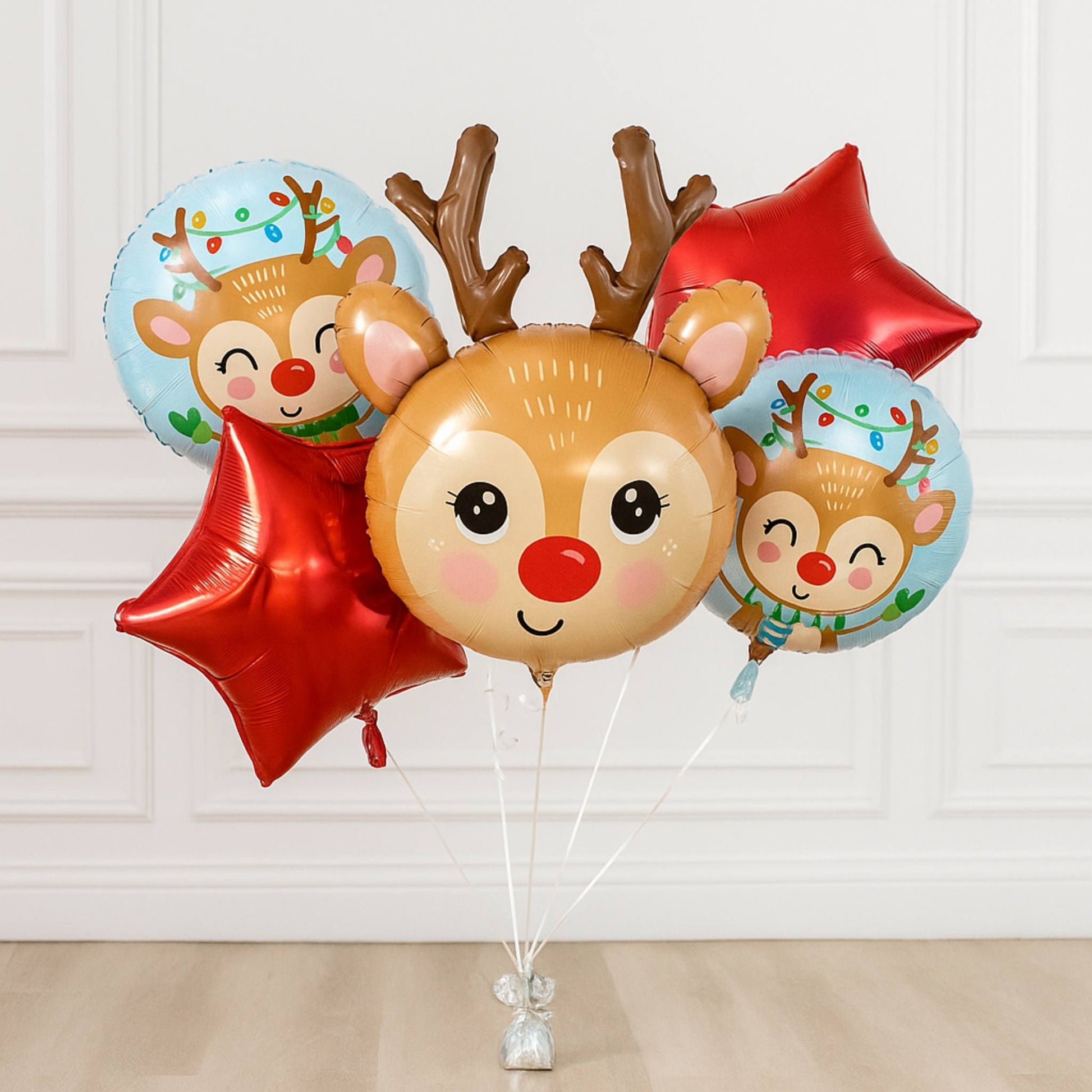 Set of reindeer-themed balloons on a white background