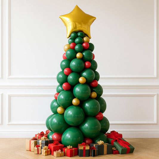 Balloon Christmas tree with presents against a white wall
