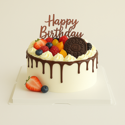 A chocolate drip cake decorated with a variety of fruits including strawberries, blueberries, and raspberries, with a 'Happy Birthday' topper and a cookie.