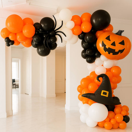 Halloween-themed balloon arch with orange, black, and white balloons.