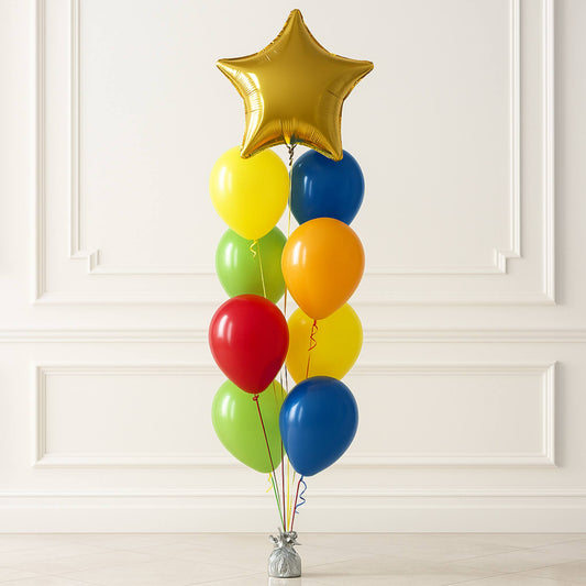 Colorful balloon bouquet with a gold star balloon against a white wall.