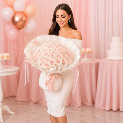 Woman holding a large bouquet of pink roses in a celebratory setting with balloons and cake.