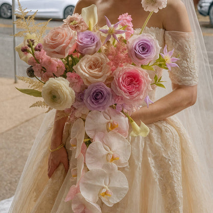 Bride holding a bouquet of flowers with a blurred background