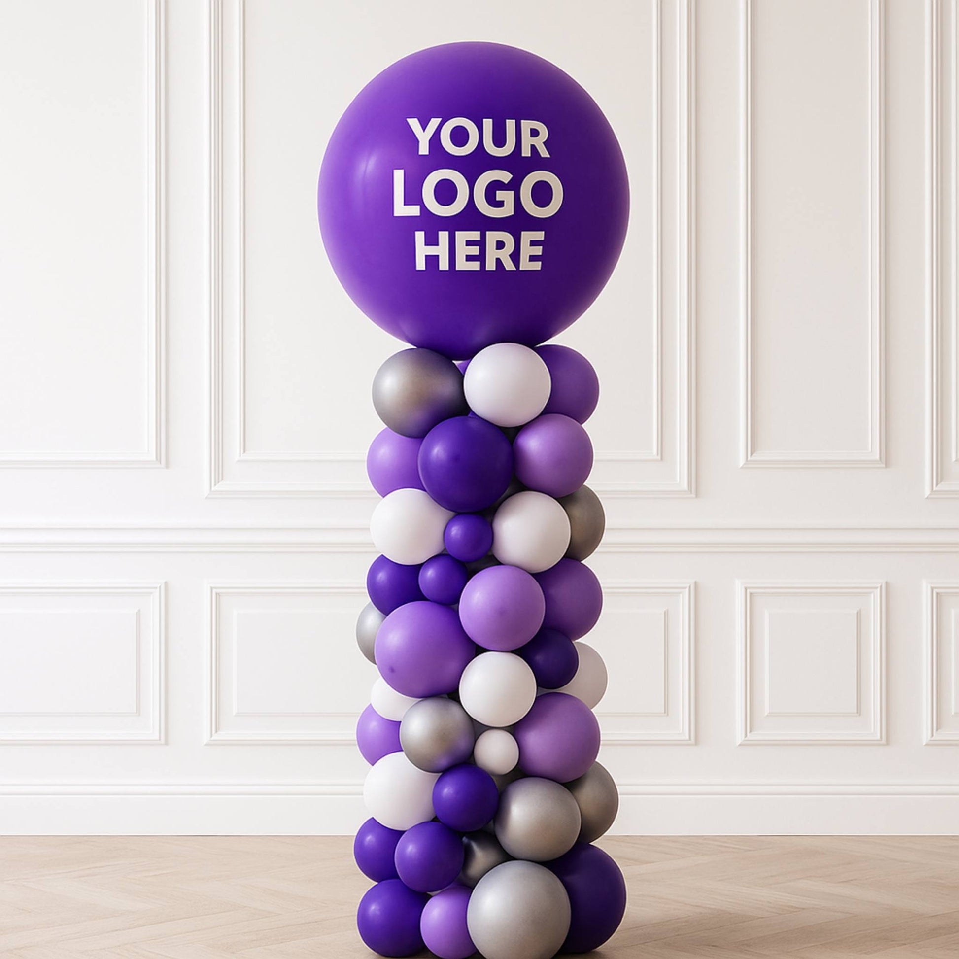 Balloon column with a purple balloon labeled 'Your Logo Here' against a white paneled wall.