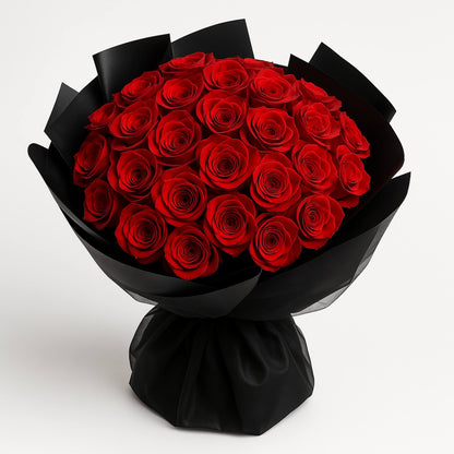 Bouquet of red roses wrapped in black paper on a white background