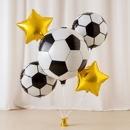 Set of soccer ball and star-shaped balloons against a plain background