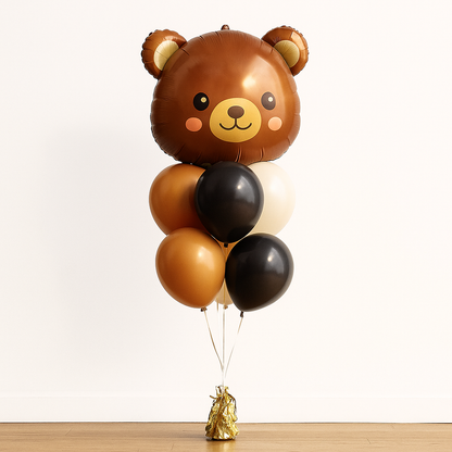 Bear-shaped balloon with additional balloons on a white background