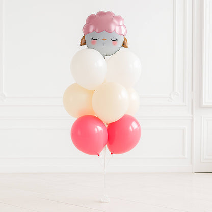Balloon arrangement with a face design on a white background
