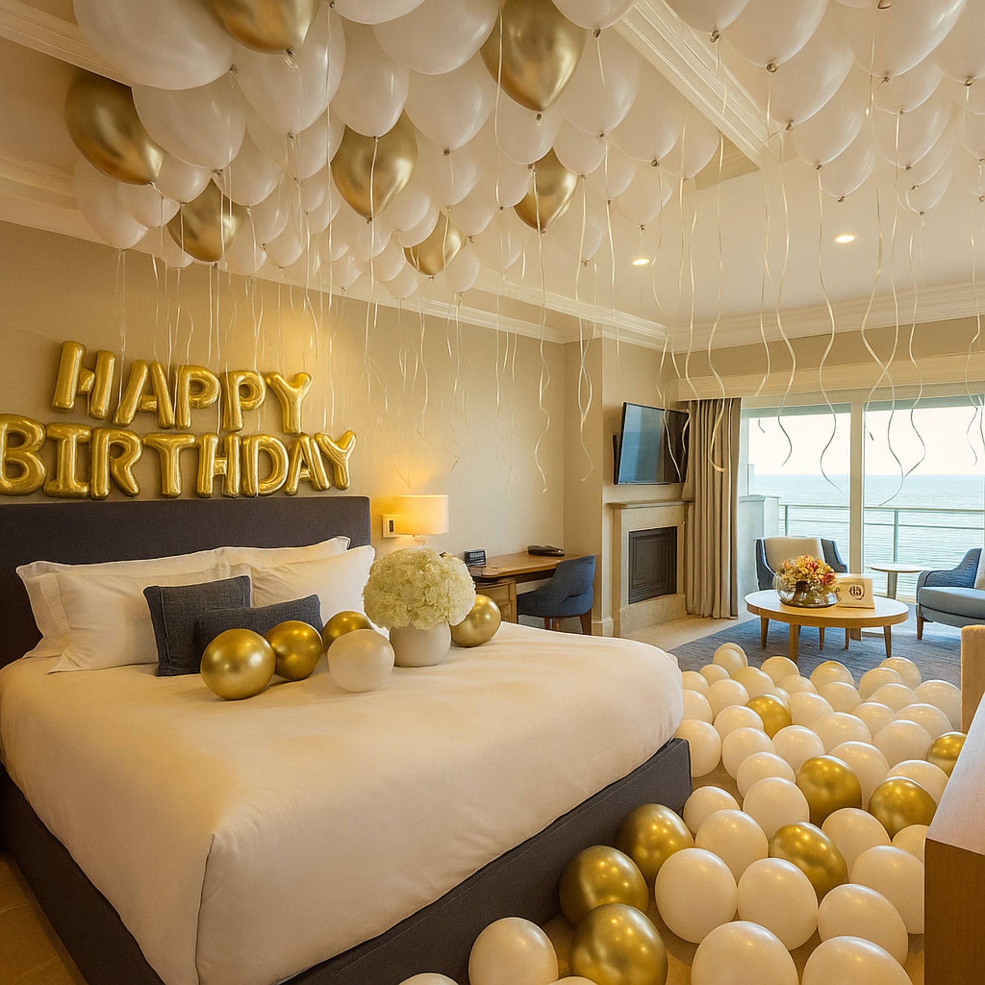 Decorated bedroom with balloons, 'Happy Birthday' sign, and a view of a cityscape.