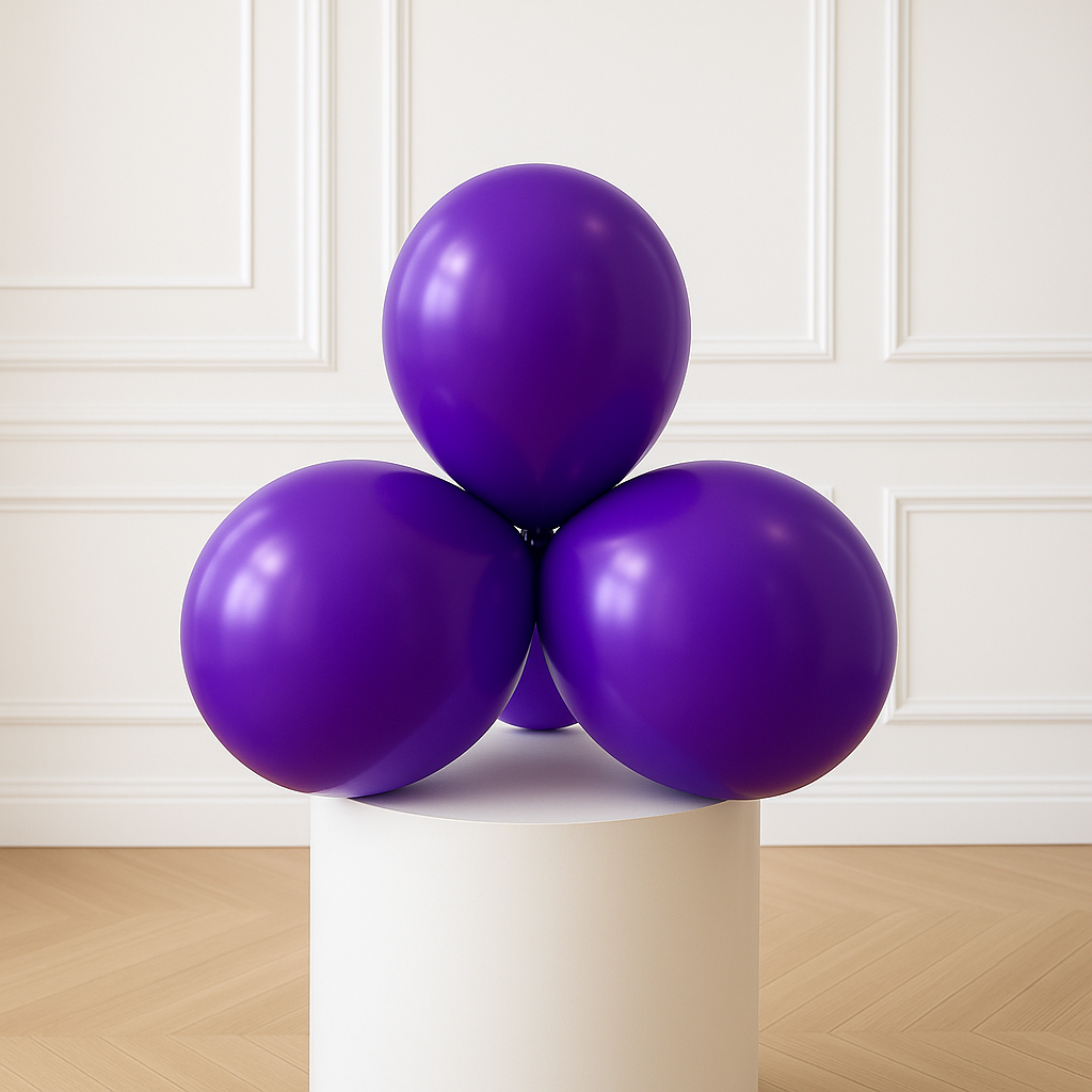 Three purple balloons on a white pedestal against a white paneled wall.