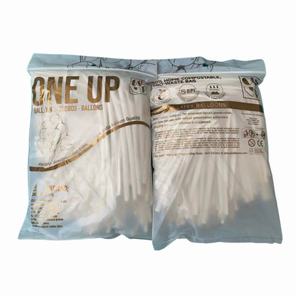 A sealable bio-degradable bag containing 100 white flexible balloons for twisting, with the 'One-Up' brand and product information printed on the side.