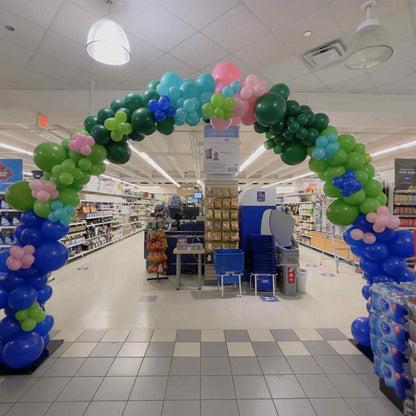 Balloon arch in a grocery store with colorful balloons