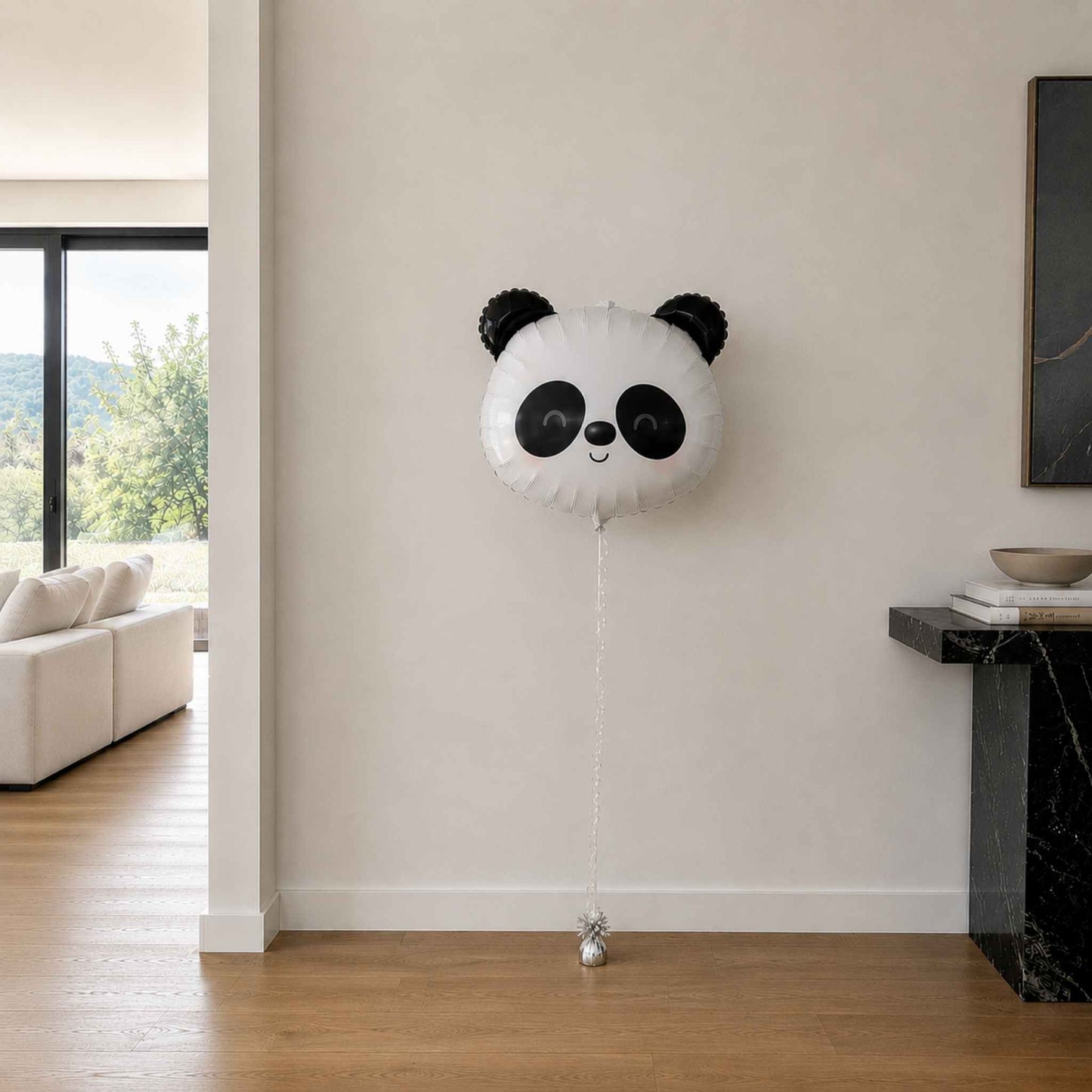 Panda-shaped balloon in a living room setting