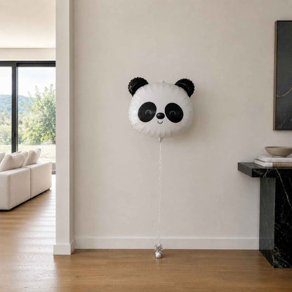 Panda-shaped balloon in a living room setting