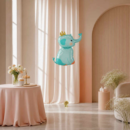 Decorative elephant balloon in a stylish room with pink curtains and table.