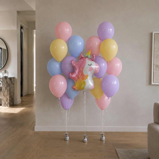 Colorful balloons with a unicorn balloon in a living room setting