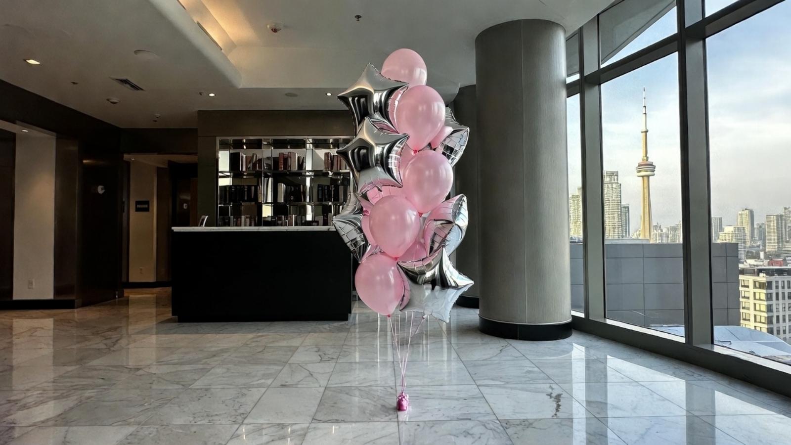 Load video: anniversary balloon bouquets, flowers, and cakes large room penthouse