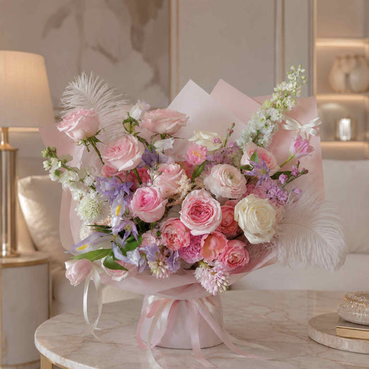 Pink roses with flower assortments on a table in a luxury house