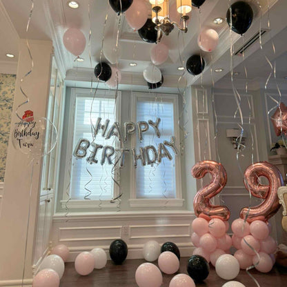 Decorated room with balloons and 'Happy Birthday' and number '29' balloons.