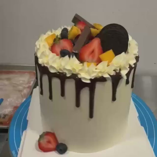 Classic Chocolate drip on fruits cake