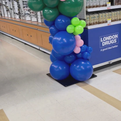 Balloon arch blue with green event setup at london drugs