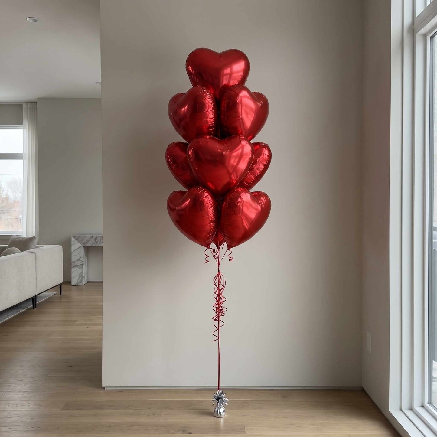 A single bouquet of red heart-shaped balloons.