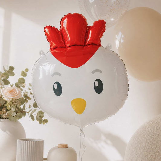 Chicken-shaped balloon with a red crown in a decorative setting