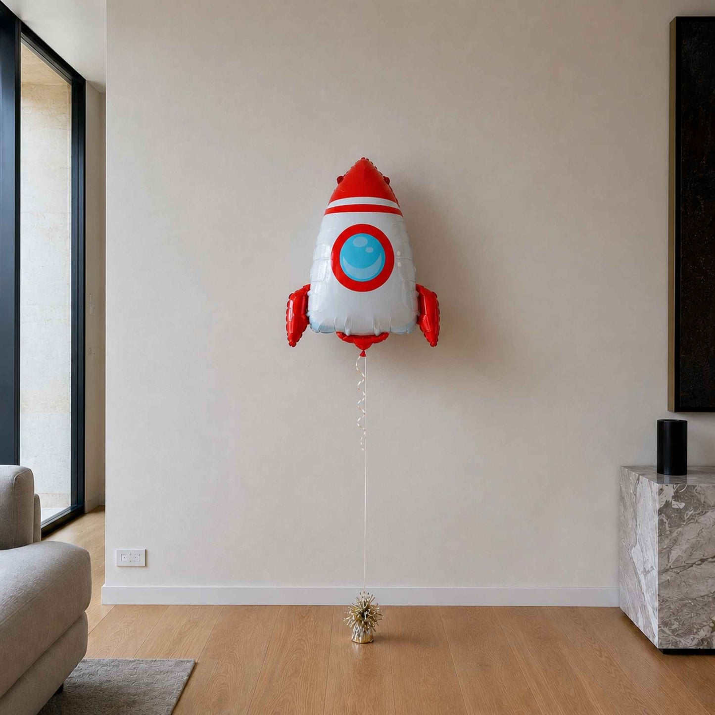 Rocket-shaped balloon in a living room setting