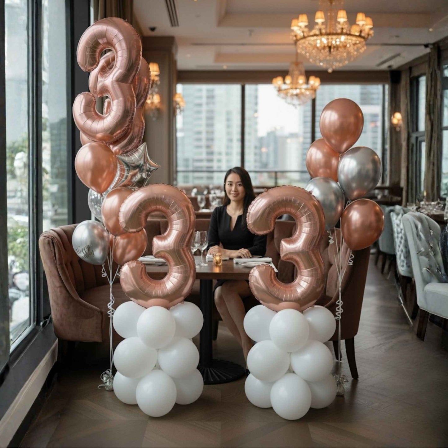 Balloon decorations with numbers '33' in a restaurant setting
